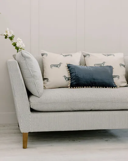 Blue velvet cushion with beaded braid